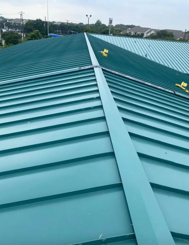Green commercial metal roof ridge and valley for Metal Roof Repair in Oakwood