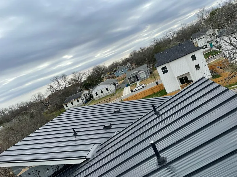 Standing seam metal roof panels with vents for Skylight Repair in Oakwood